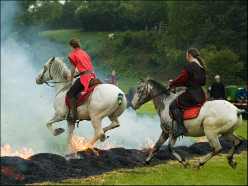 French Fraternity Hazing Horse and riders jumping fire