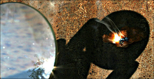 Magnifying glass creating fire