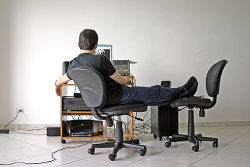 Man on a computer with his feet up